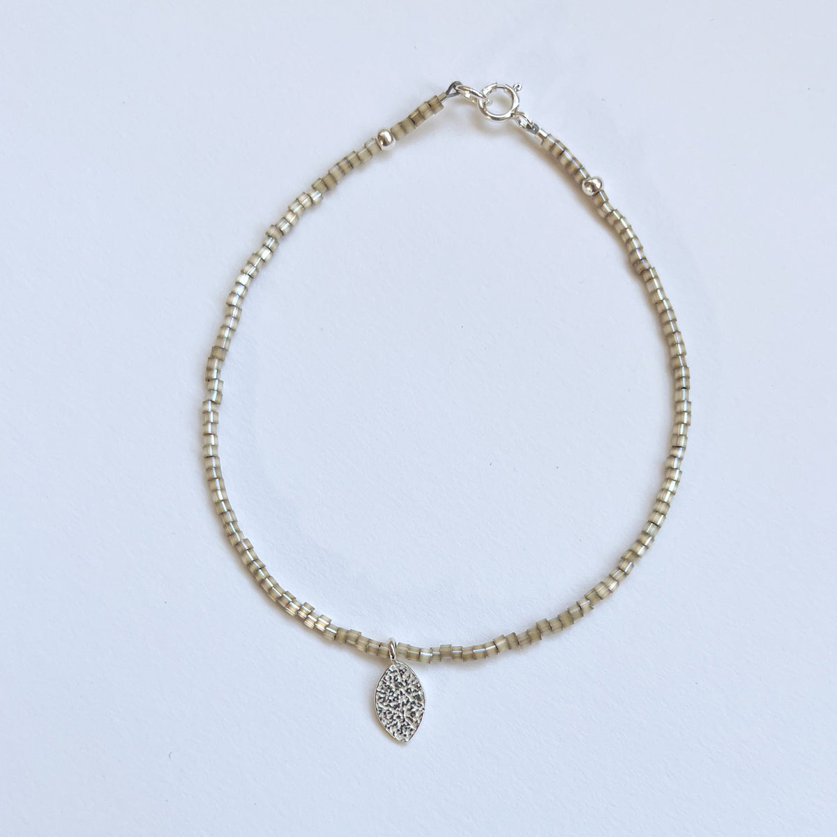 Beaded Bracelet with Frosted Silver Leaf Charm