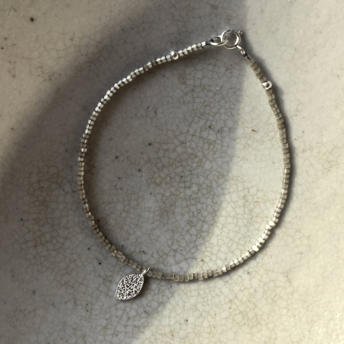 Beaded Bracelet with Frosted Silver Leaf Charm